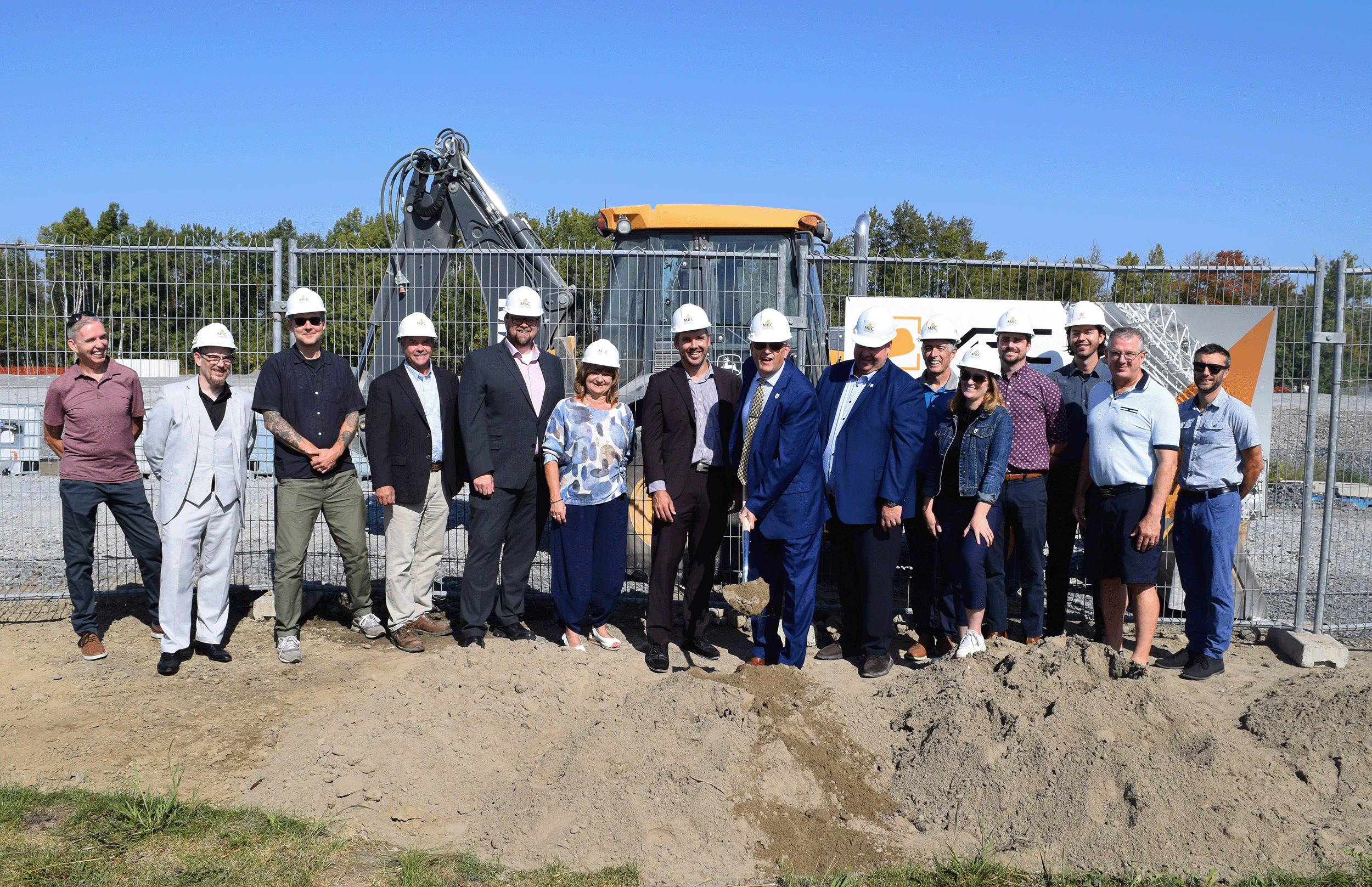 Group in front of construction site